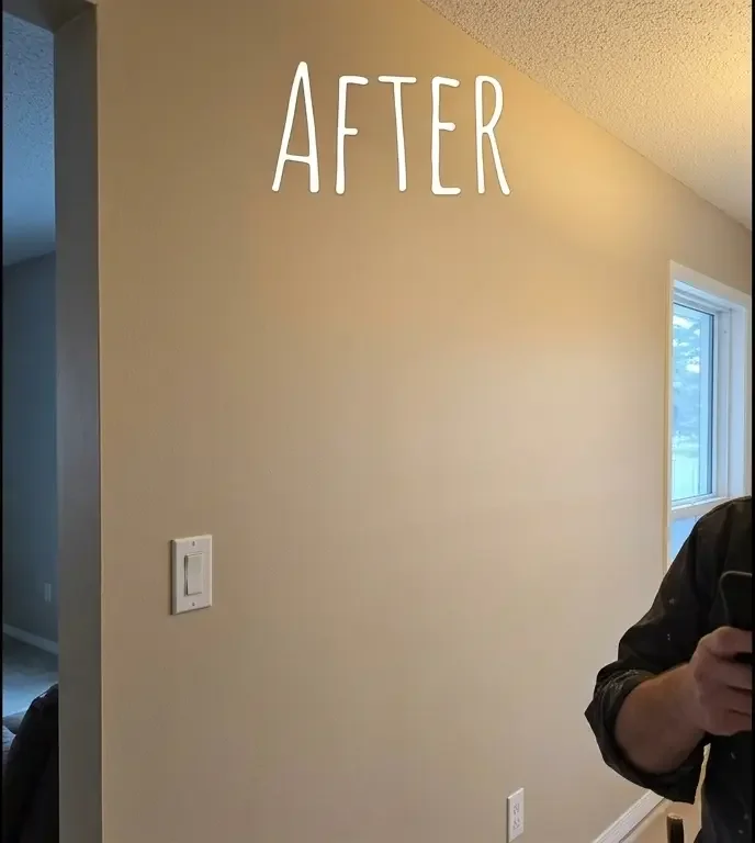 After: Freshly painted living room wall with smooth finish
