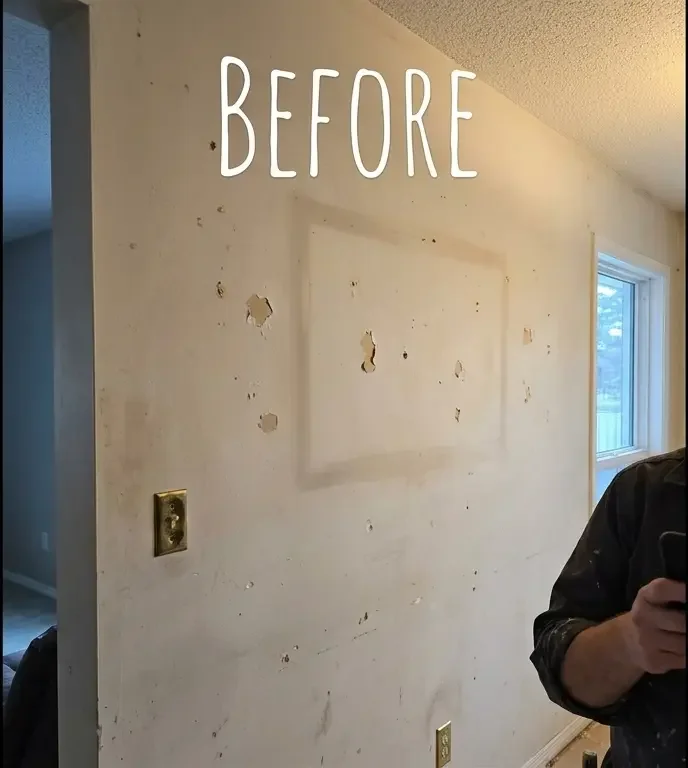 Before: Living room wall with scuffs and settling cracks